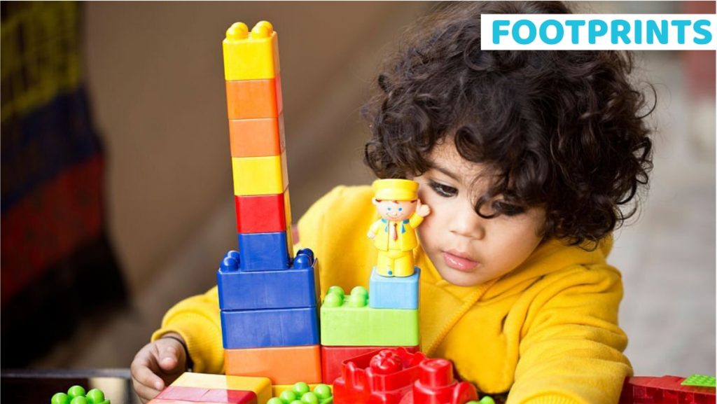 Toddler playing with building blocks