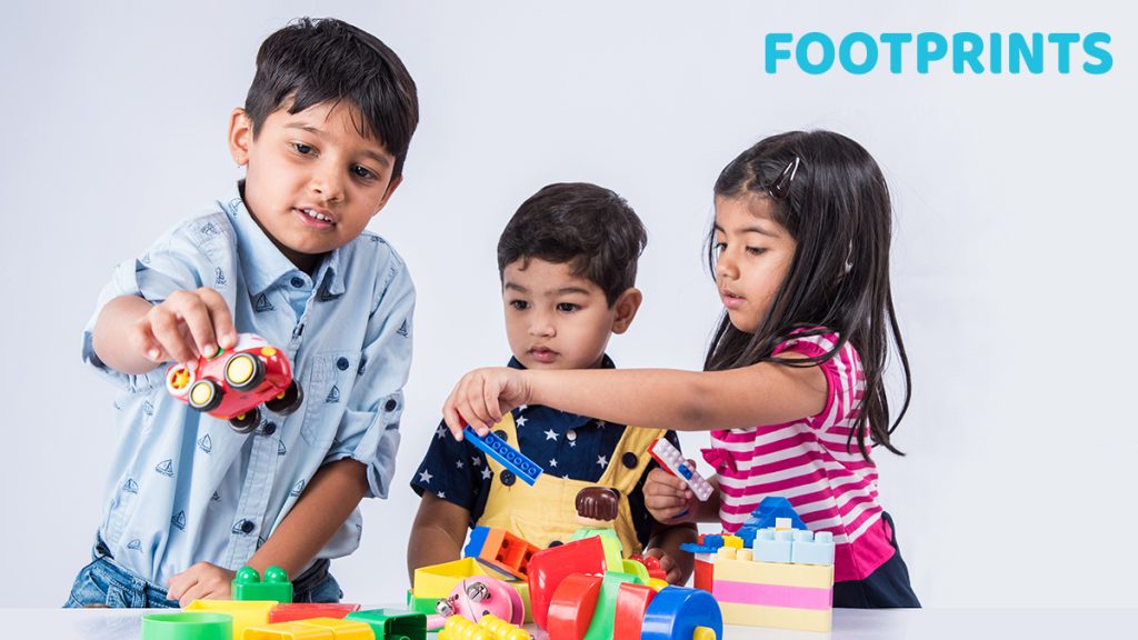 children playing with toys and learning social skills